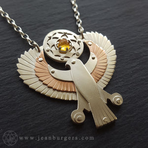 Handcut Egyptian Horus Pendant - holding citrine seed of life