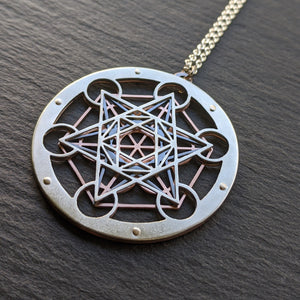 Large Metatron's Cube Pendant by Jean Burgers Jewellery. Handcut from sterling silver and copper, with gold rivets.