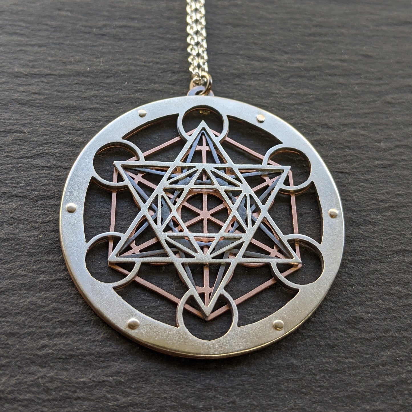 Large Metatron's Cube Pendant by Jean Burgers Jewellery. Handcut from sterling silver and copper, with gold rivets.
