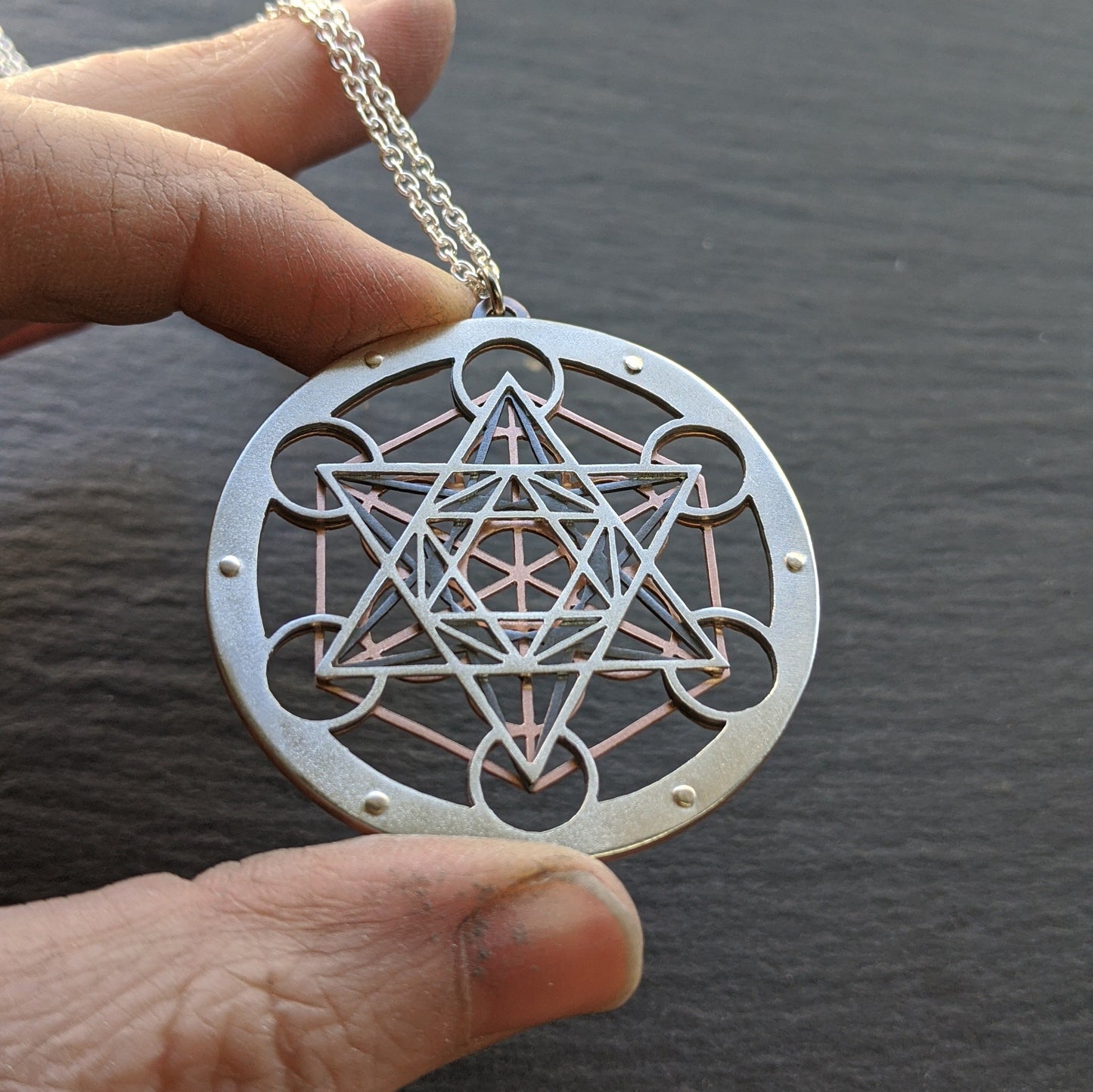 Large Metatron's Cube Pendant by Jean Burgers Jewellery. Handcut from sterling silver and copper, with gold rivets.