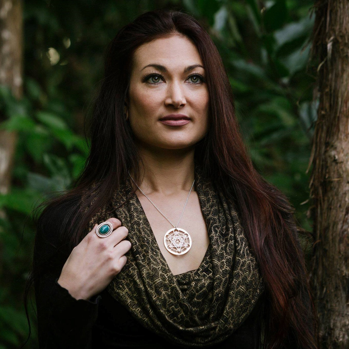 Model wearing Large Metatron's Cube Pendant by Jean Burgers Jewellery. Handcut from sterling silver and copper, with gold rivets.